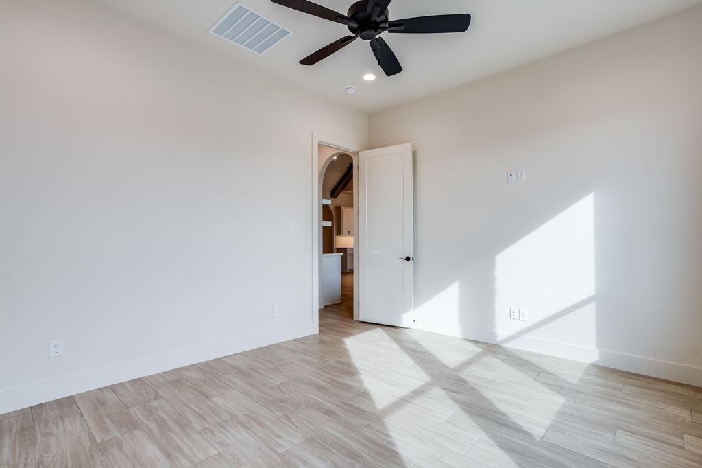 128 Prairie Winds Drive Poolville, TX 76487 - Photo 27 of 40 a view of empty room with wooden floor