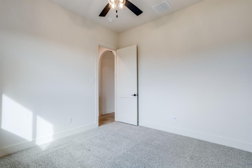 128 Prairie Winds Drive Poolville, TX 76487 - Photo 29 of 40 an empty room with chandelier fan
