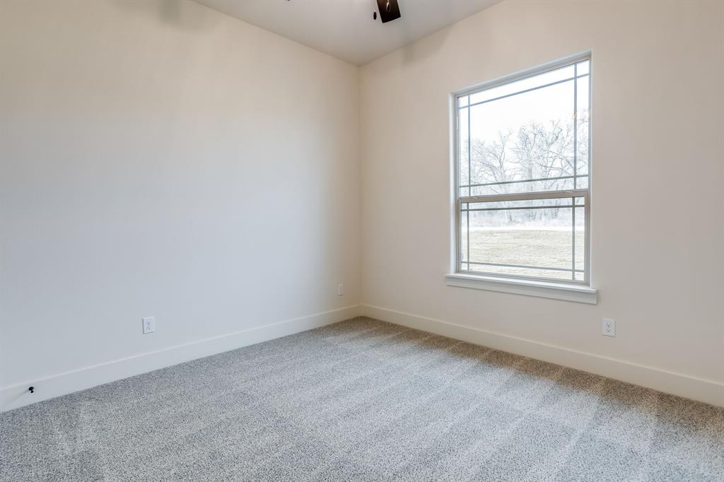 128 Prairie Winds Drive Poolville, TX 76487 - Photo 30 of 40 an empty room with a window