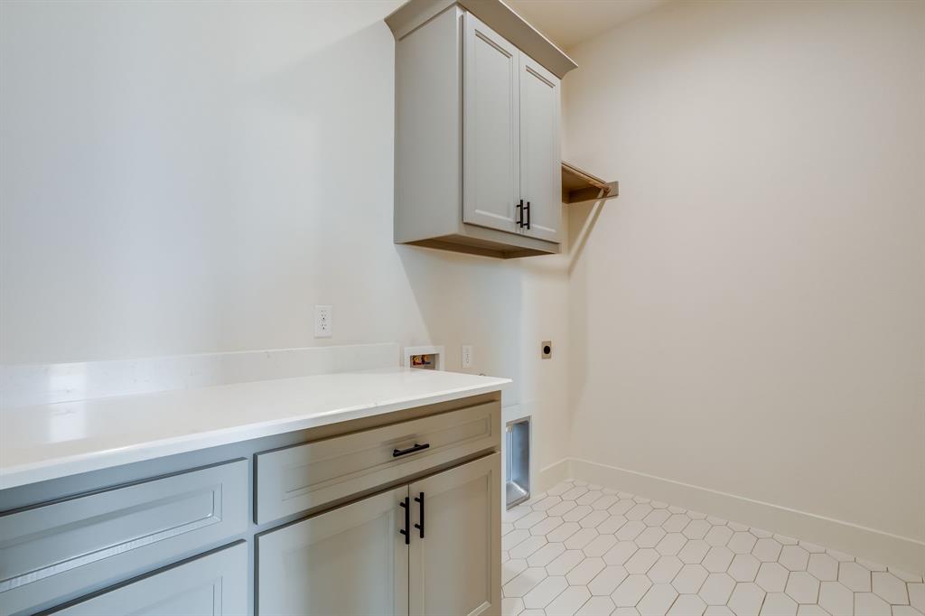 128 Prairie Winds Drive Poolville, TX 76487 - Photo 40 of 40 a utility room with cabinets