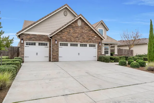 a view of house with backyard