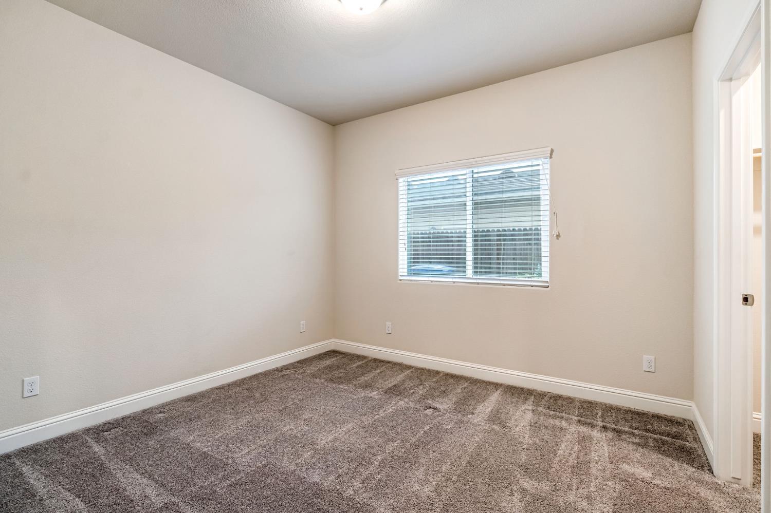 462 Crescent Lane Madera, CA 93636 - Photo 24 of 35 an empty room with a window