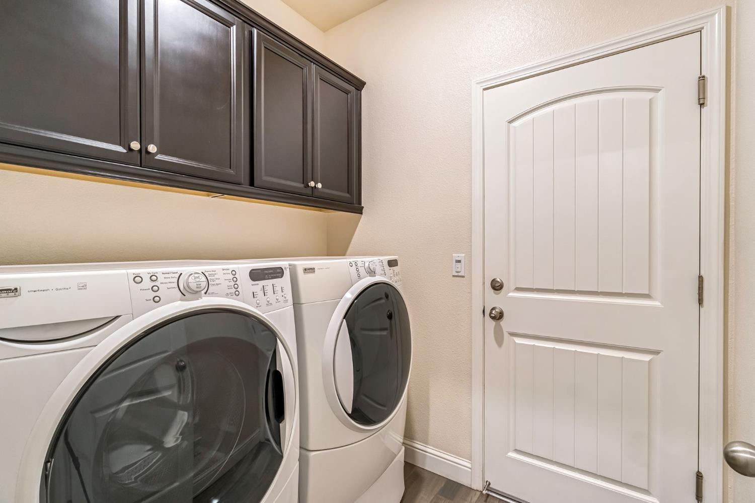 462 Crescent Lane Madera, CA 93636 - Photo 26 of 35 a close view of utility and utility room with washer and dryer