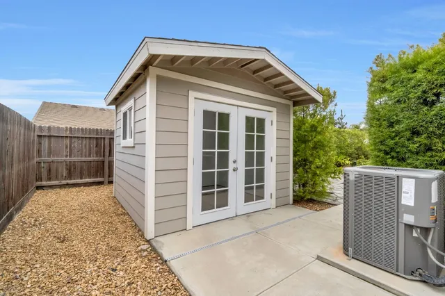 a front view of a house with a large window