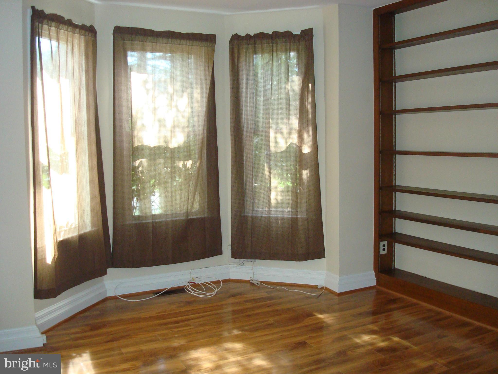 5718 Berwyn Road Berwyn Heights, MD 20740 - Photo 3 of 30 a view of an empty room with a window