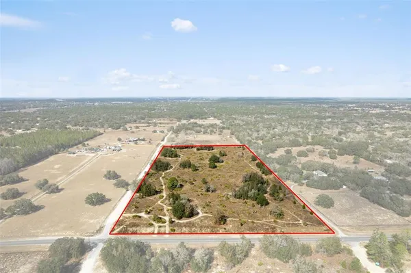 an aerial view of beach and ocean