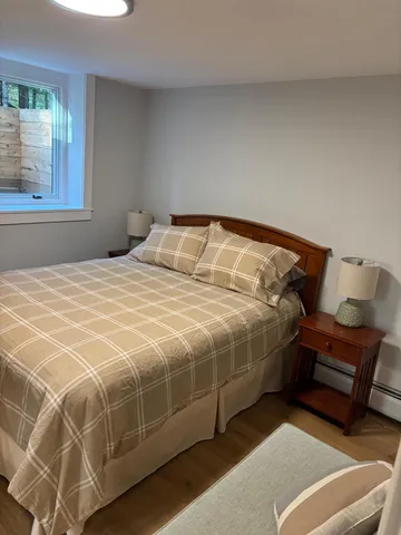 a bedroom with a bed and a couch