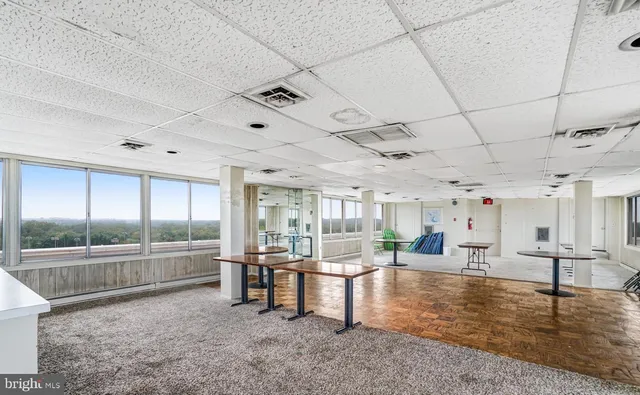 a kitchen with stainless steel appliances granite countertop a sink a stove and a wooden floors