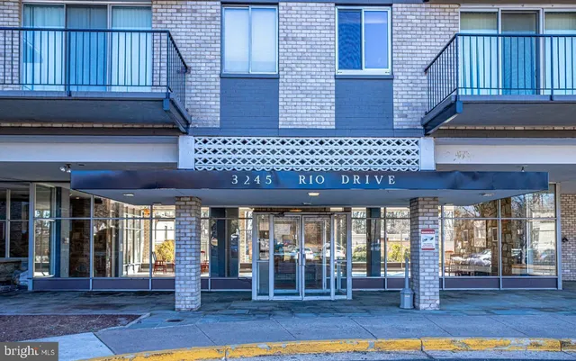 a view of a building with sitting area