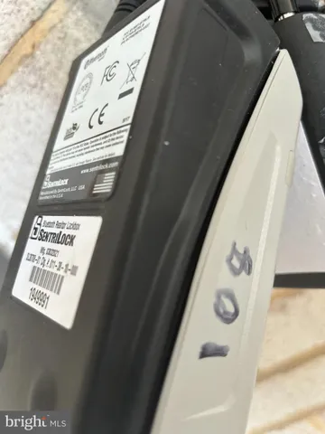 a wooden bench sitting in front of a building