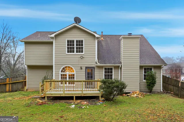 a view of house with outdoor space and swimming pool