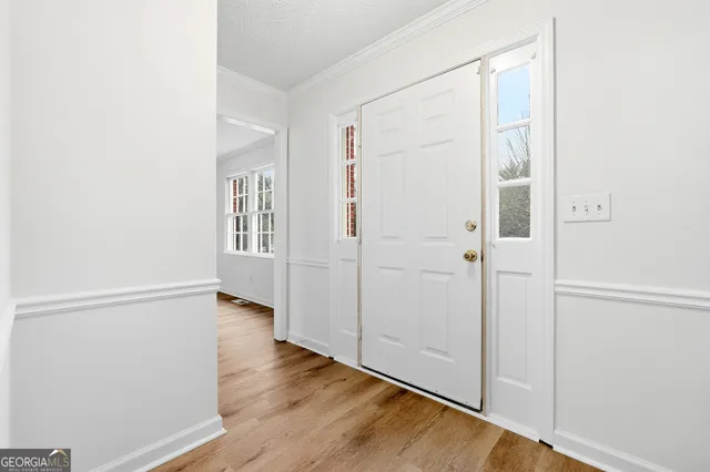 an empty room with wooden floor