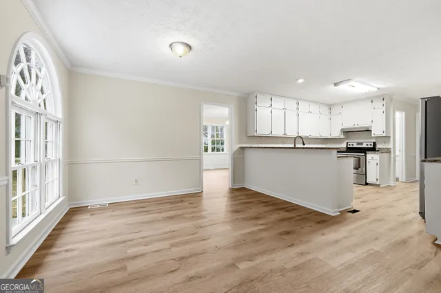 a view of kitchen with wooden floor