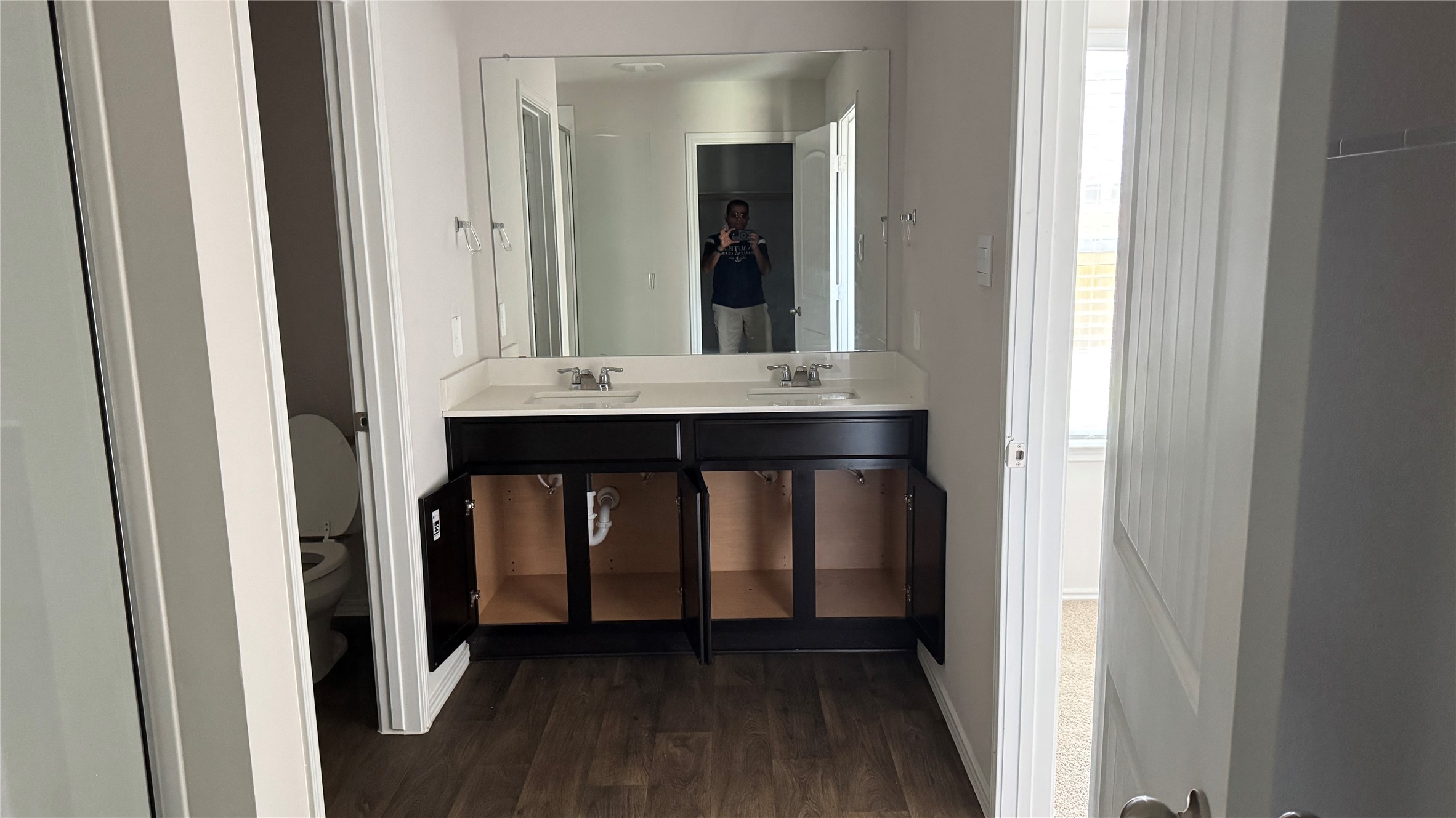 408 Frogmore Loop Kyle, TX 78640 - Photo 15 of 32 Double vanity with ample storage and a broad mirror anchors this functional primary bathroom.