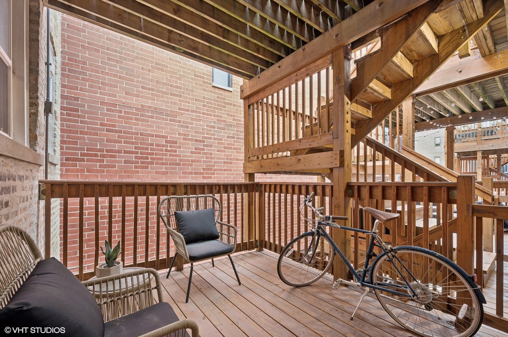 725 West Buckingham Place, Unit 2 Chicago, IL 60657 - Photo 15 of 15 a view of a chairs with wooden deck