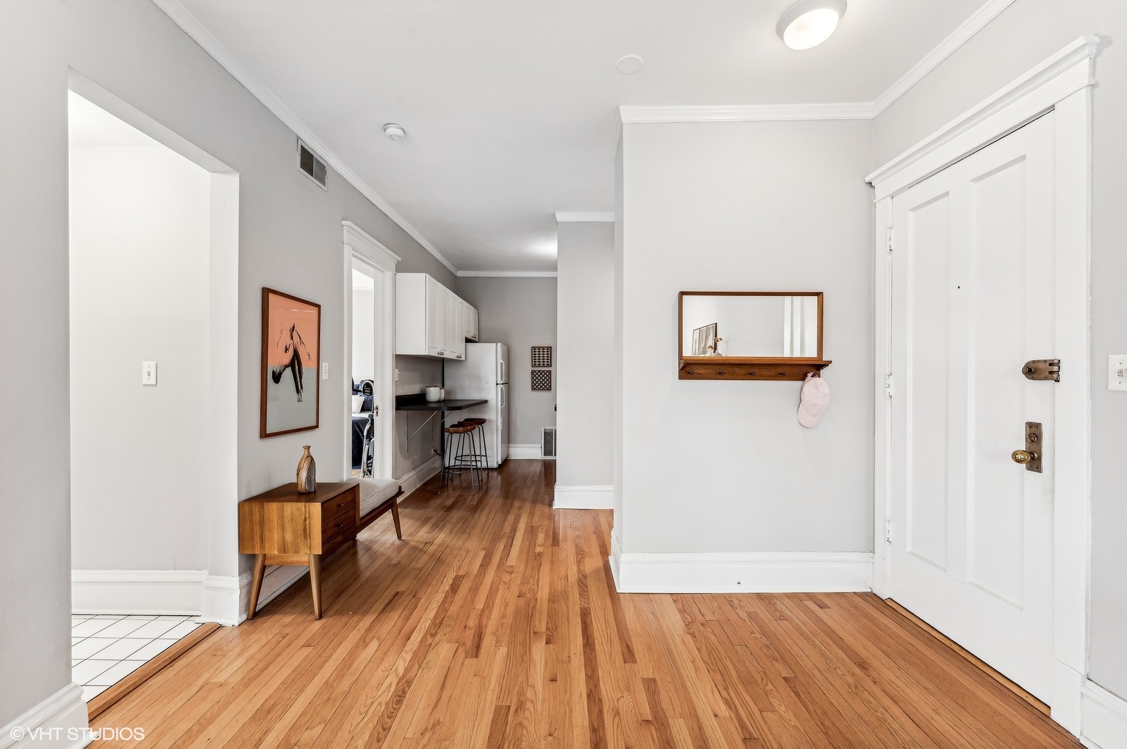 725 West Buckingham Place, Unit 2 Chicago, IL 60657 - Photo 7 of 15 a view of a hallway with wooden floor and furniture
