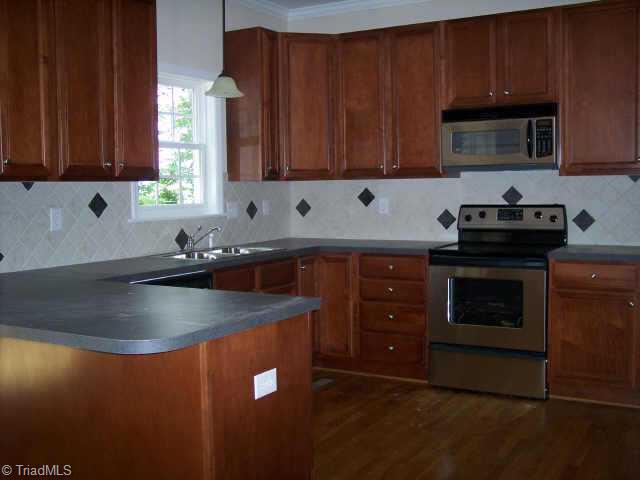 110 Peppertree Road Clemmons, NC 27012 - Photo 2 of 9 Other. Stainless Steel Appliances, Hardwood Floors & Kitchen Cabinets in Rich Tones