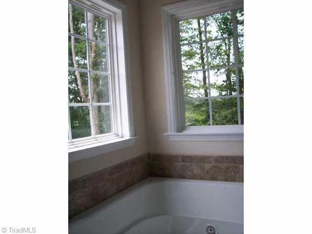 110 Peppertree Road Clemmons, NC 27012 - Photo 7 of 9 Other. Corner Windows and Tile Surround add a Splash to the Jetted Master Tub