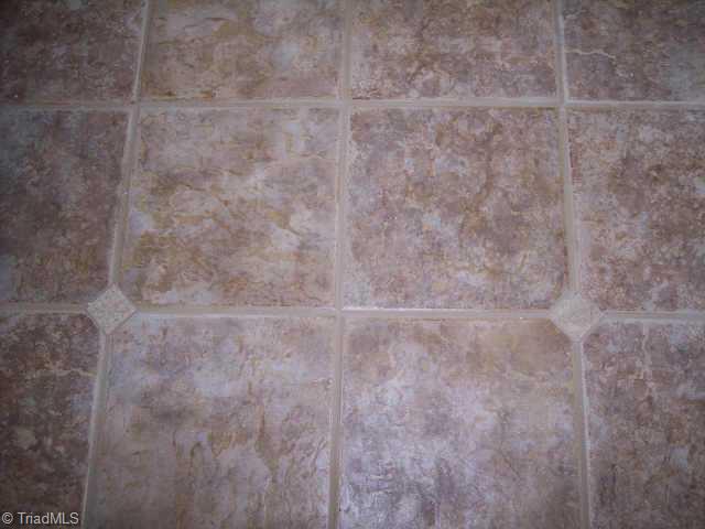 110 Peppertree Road Clemmons, NC 27012 - Photo 8 of 9 Other. The Tile Floor in the Master Bathroom has Diamond-shaped Accents