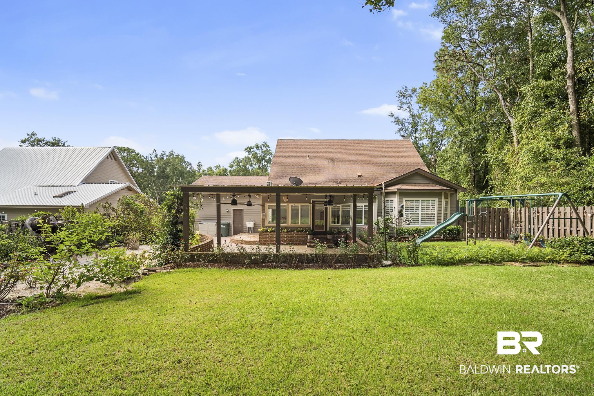 178 Lakeview Loop Daphne, AL 36526 - Photo 33 of 43 Back of property with ceiling fan and a patio area