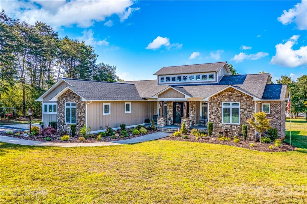 2515 Sandy Ford Road Newton, NC 28658 - Photo 20 of 38 a front view of a house with swimming pool and porch