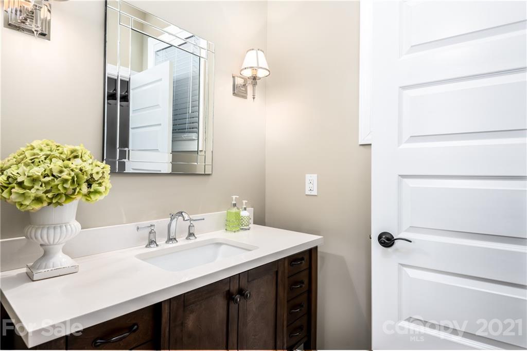 2515 Sandy Ford Road Newton, NC 28658 - Photo 22 of 38 a bathroom with a sink vanity and a mirror