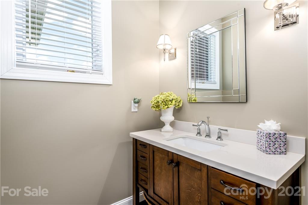 2515 Sandy Ford Road Newton, NC 28658 - Photo 25 of 38 a bathroom with a sink and a mirror