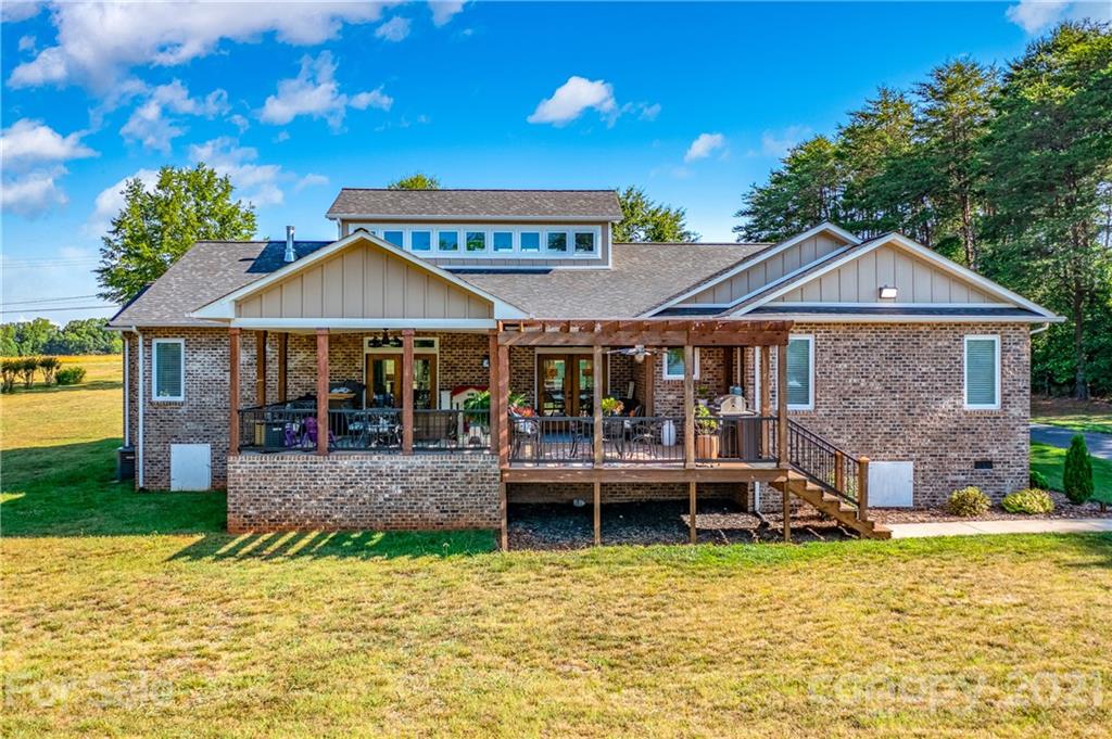 2515 Sandy Ford Road Newton, NC 28658 - Photo 29 of 38 a front view of a house with garden