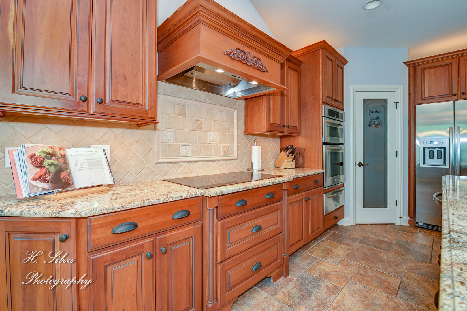 11 Covington Court Algonquin, IL 60102 - Photo 11 of 51 a kitchen with granite countertop a sink and dishwasher a stove with wooden cabinets