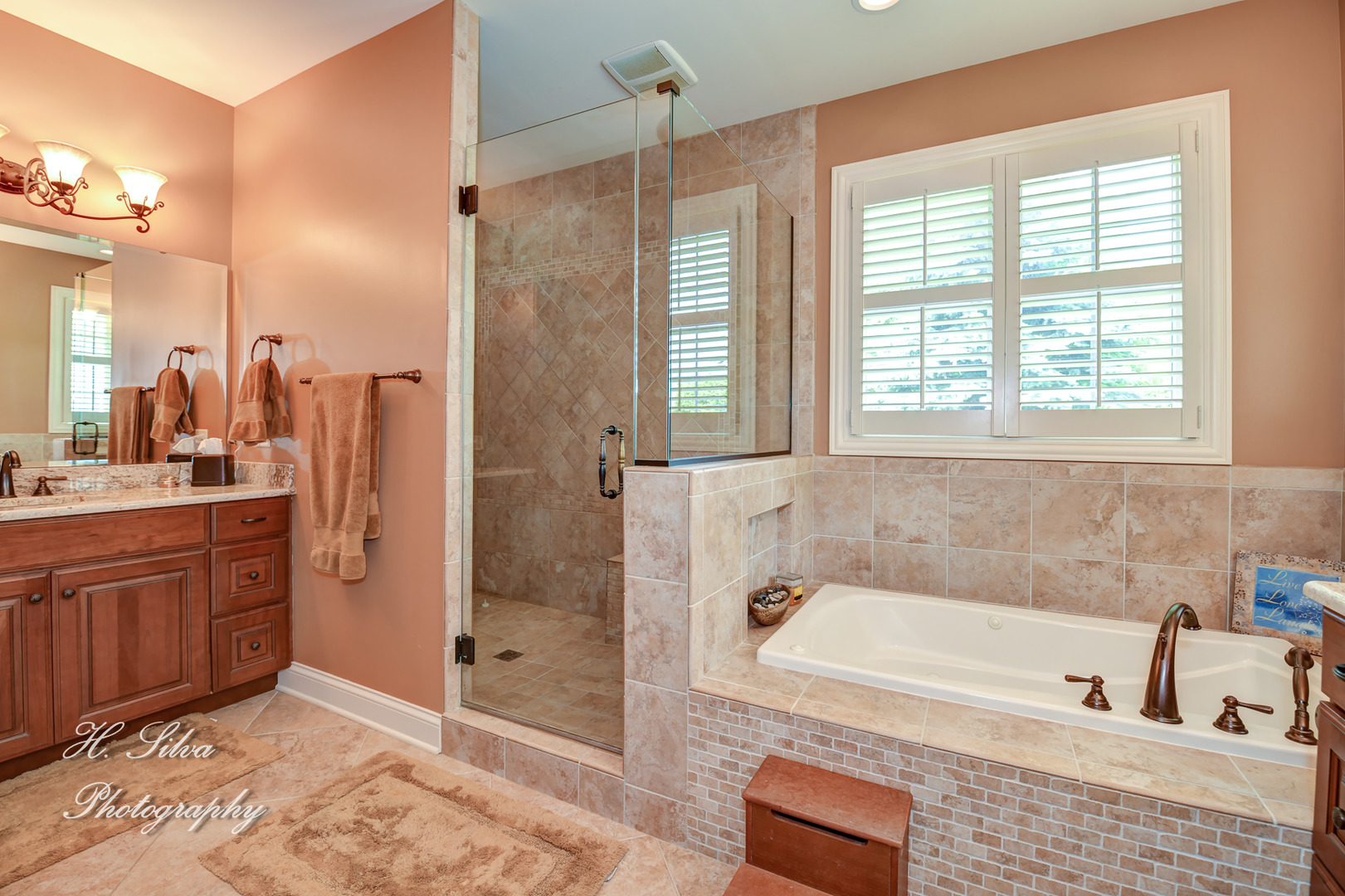 11 Covington Court Algonquin, IL 60102 - Photo 18 of 51 a bathroom with a tub sink shower and mirror