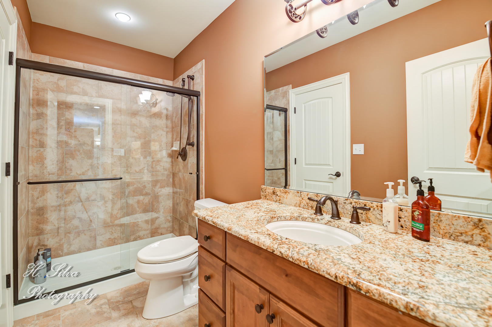 11 Covington Court Algonquin, IL 60102 - Photo 38 of 51 a bathroom with a granite countertop sink a toilet a mirror and shower