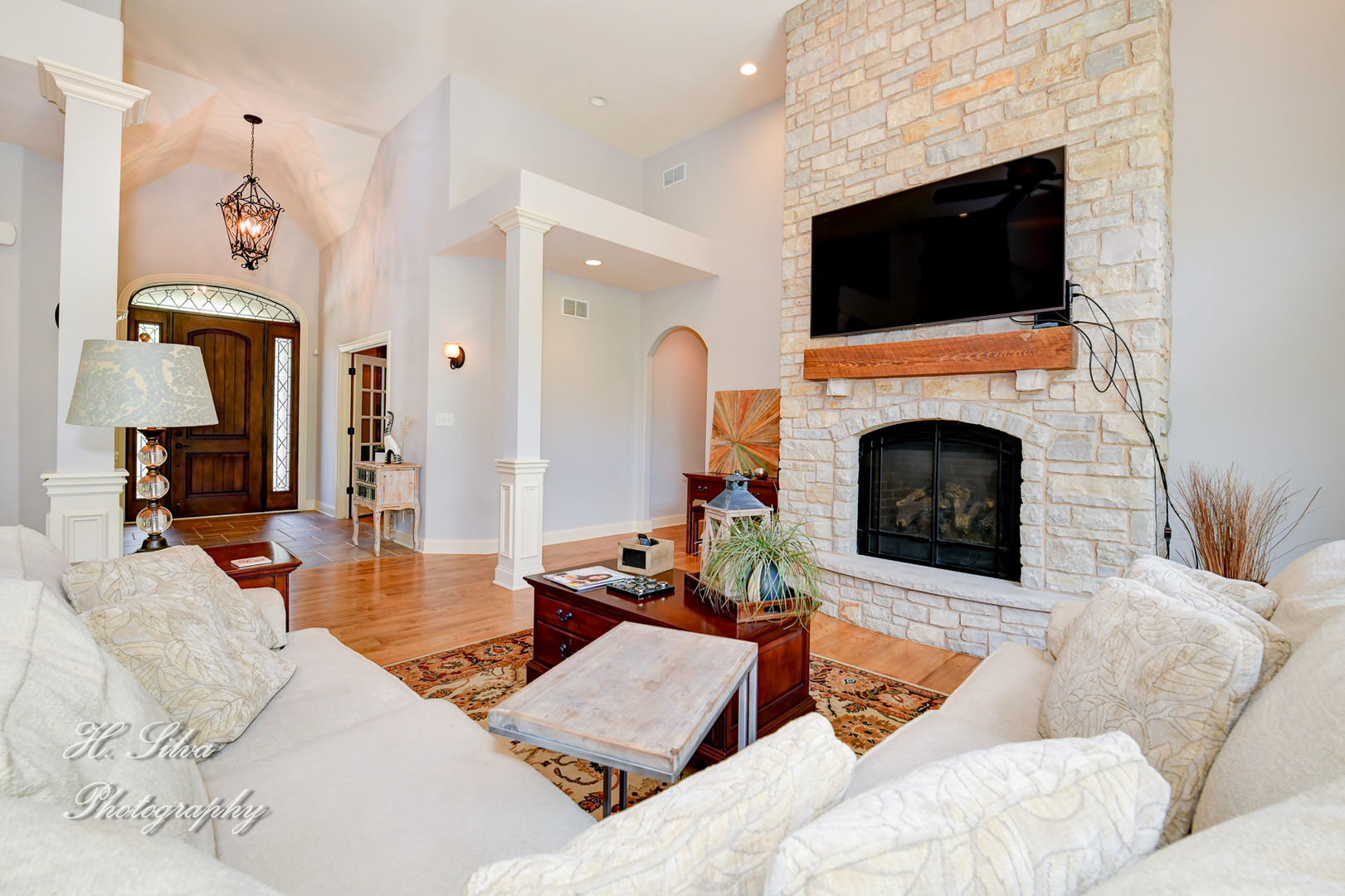 11 Covington Court Algonquin, IL 60102 - Photo 7 of 51 a living room with furniture a flat screen tv and a fireplace