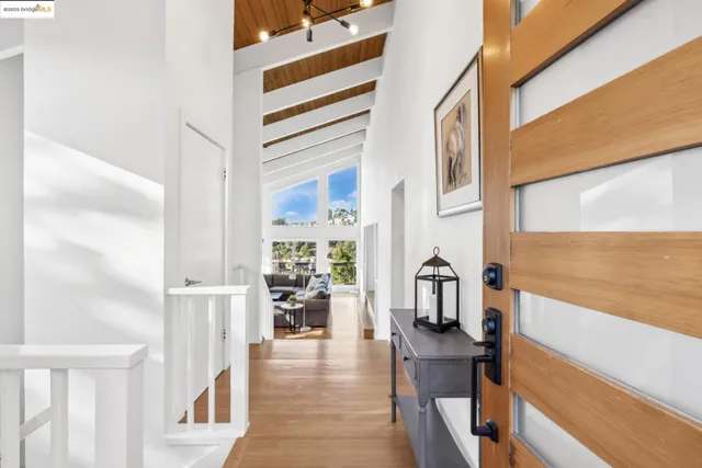 a view of living room with furniture and wooden floor