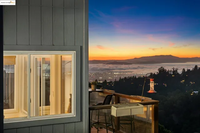 a spacious bedroom with a bed and a large window