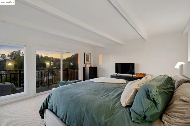 a view of a balcony with furniture