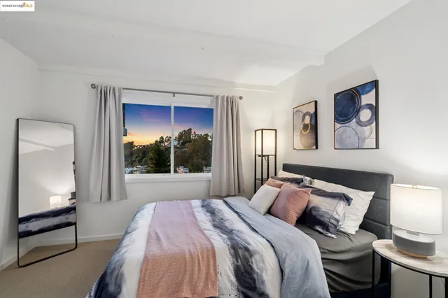 a view of a dining room with furniture and a rug