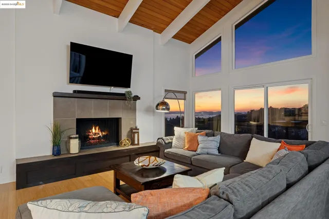 a living room with furniture fireplace and a flat screen tv