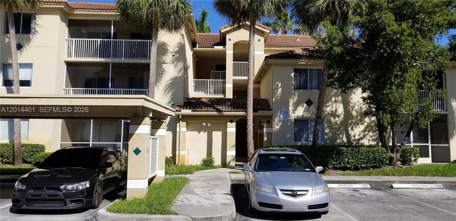 470 South Park Road, Unit 7110 Hollywood, FL 33021 - Photo 1 of 18 a car parked in front of a building