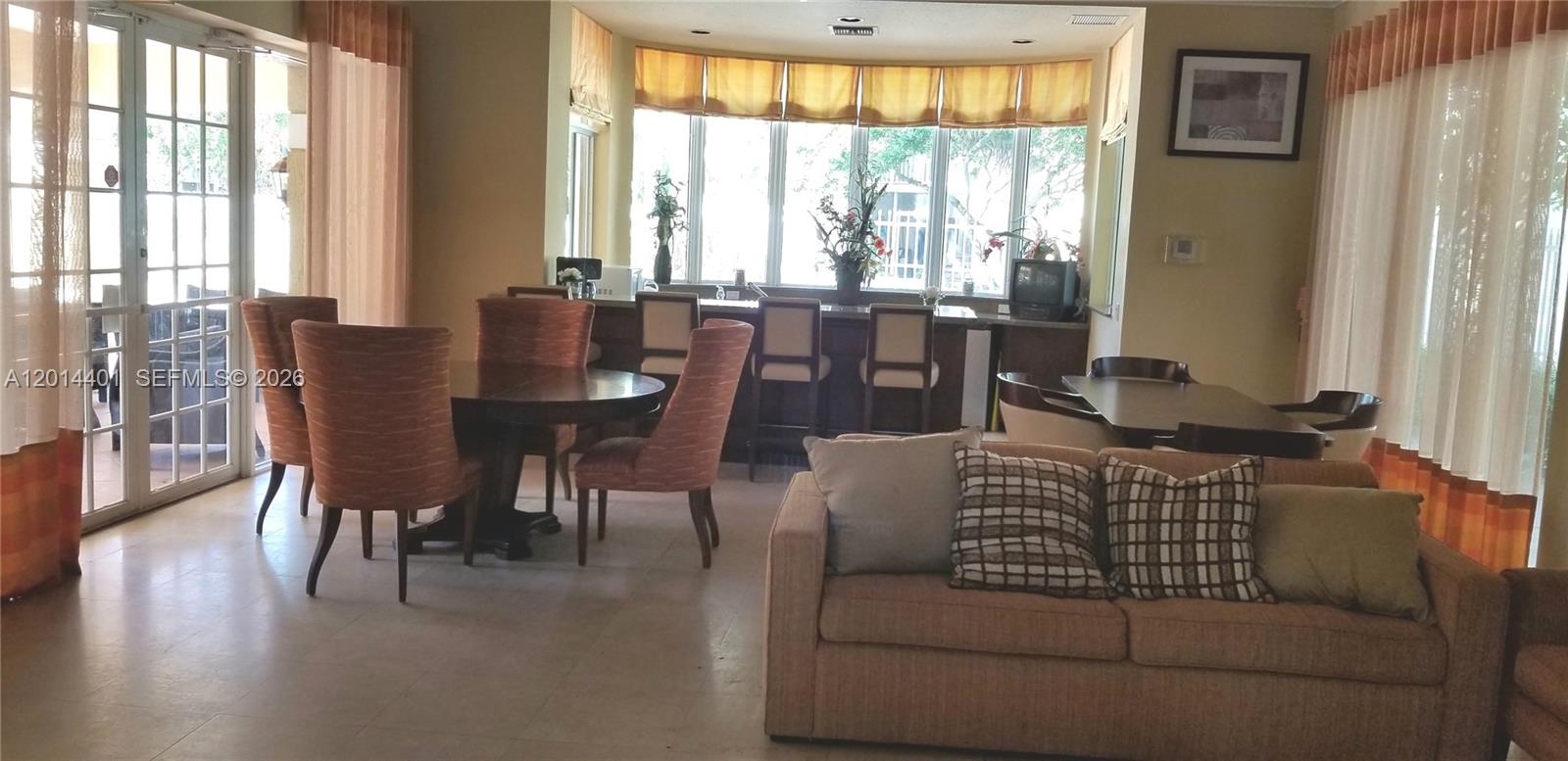 470 South Park Road, Unit 7110 Hollywood, FL 33021 - Photo 17 of 18 a view of a dining room with furniture window and wooden floor