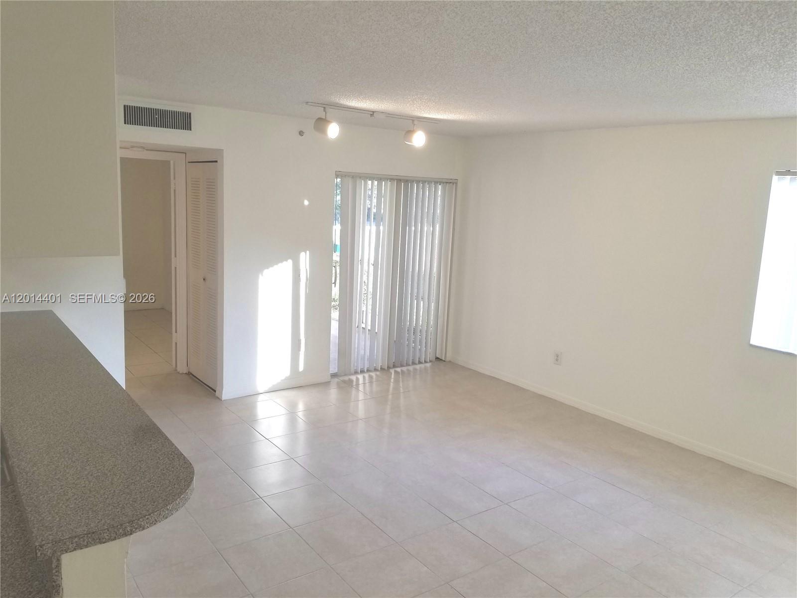 470 South Park Road, Unit 7110 Hollywood, FL 33021 - Photo 8 of 18 a view of an empty room with wooden floor and a window