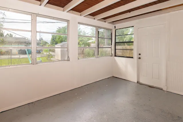 an empty room with a large window