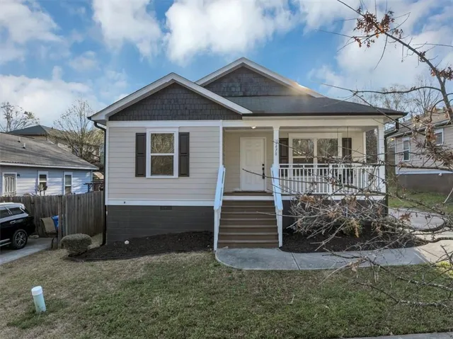 a front view of a house with garden