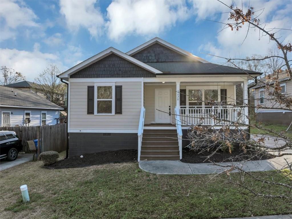 2478 Verbena Circle Northwest Atlanta, GA 30314 - Photo 1 of 42 a front view of a house with garden