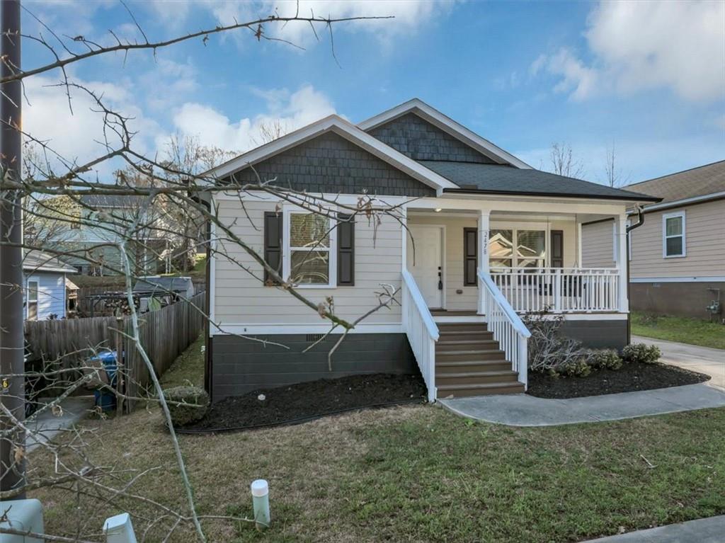 2478 Verbena Circle Northwest Atlanta, GA 30314 - Photo 2 of 42 a front view of a house with a yard