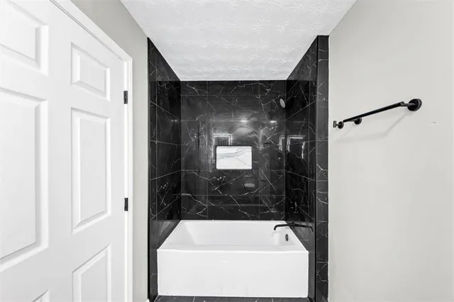 a bathroom with a bathtub