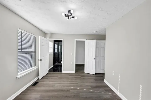 a view of an empty room with a window