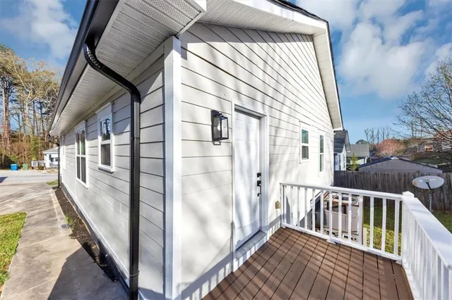 a view of a balcony with wooden floor