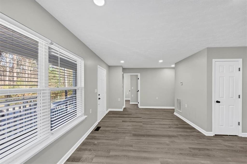 2478 Verbena Circle Northwest Atlanta, GA 30314 - Photo 6 of 42 a view of a hallway with wooden floor and windows