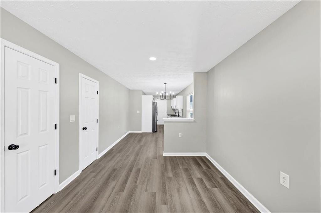 2478 Verbena Circle Northwest Atlanta, GA 30314 - Photo 7 of 42 a view of a hallway with wooden floor
