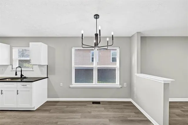 a view of a kitchen cabinets and a window